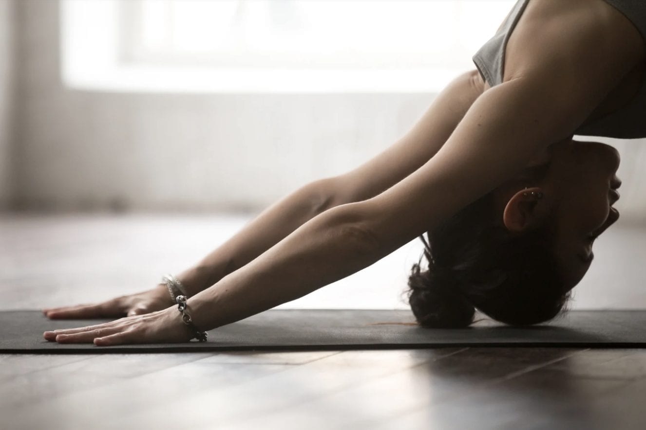 Woman bending for a yoga pose